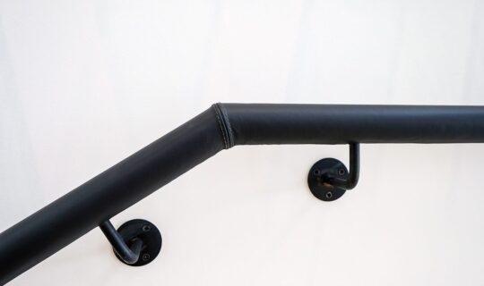 Leather clad handrail for fit out stair by Spiral UK