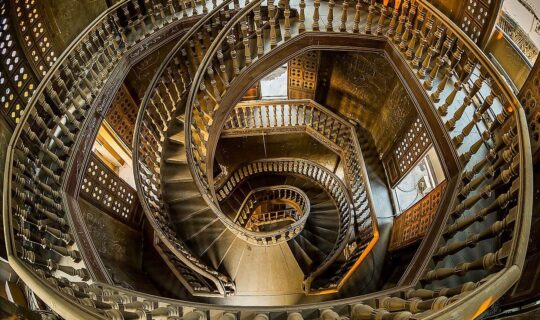 Looking down on the elaborate spiral staircase in The Baron's Palace